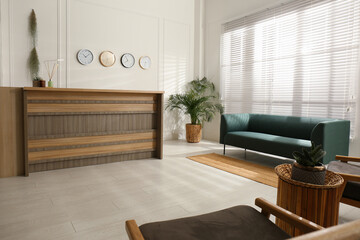 Hotel lobby interior with wooden reception desk. Stylish workplace