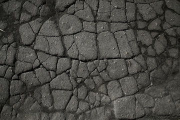 asphalt in cracks texture / abstract background cracks on asphalt road