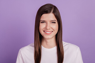 Fototapeta premium Portrait of young woman happy smile isolated over violet background