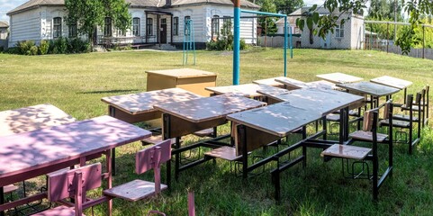 Old village school building and outdoor lessons