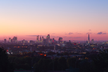 View of London city skyline at sunrise from Parliament Hill Viewpoint in England