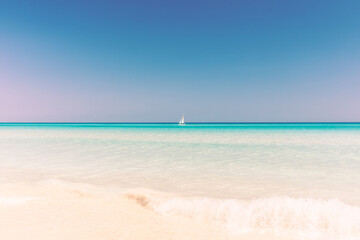 Fototapeta na wymiar sailboat on the horizon, turquoise sea, beautiful landscape