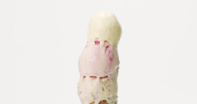 Time Lapse -  Ice cream Chocolate Chip and Vanilla on top ice cream Strawberry on white background, Front view Food concept.