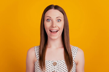 Portrait of excited crazy lady look camera open mouth on yellow background