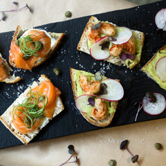 Healthy bruschetta with salmon and shrimps