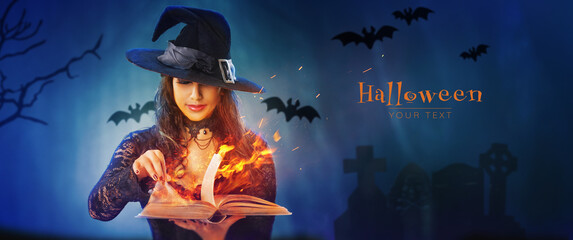 Halloween Witch girl with magic Book of spells portrait. Beautiful young woman in witches hat...