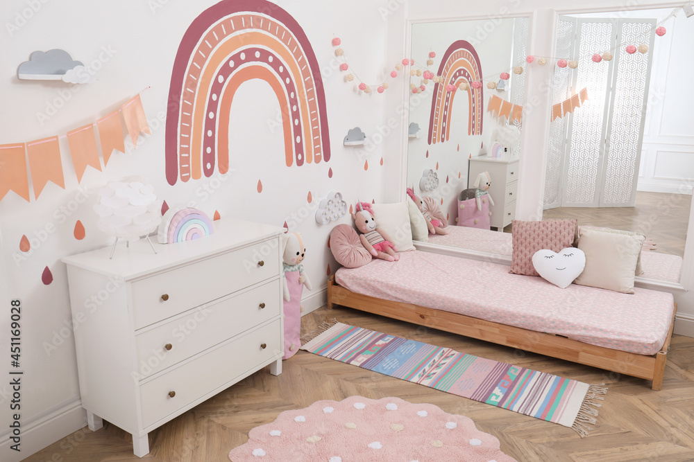 Wall mural montessori bedroom interior with floor bed and toys