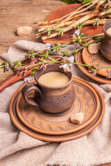 Hot natural chicory caffeine free drink in ceramic cups on a wooden table