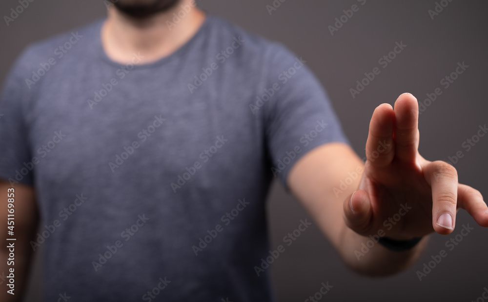 Poster Businessman pointing or touching finger in screen..