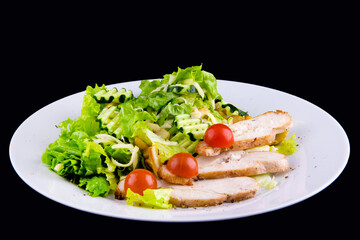Salad with baked chicken breast for a healthy diet