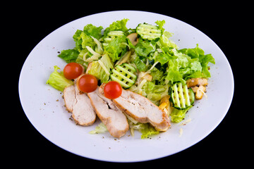 Salad with baked chicken breast for a healthy diet