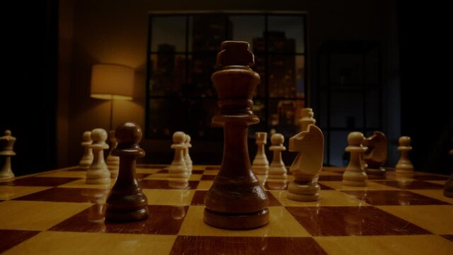 Chessman hand moves black king and captures white bishop