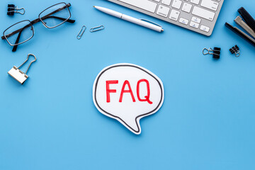 Faq - frequently asked questions - on office table, top view
