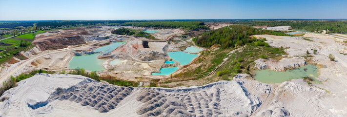 Aerial panoramic view of kaolin quarry with small turquoise lakes