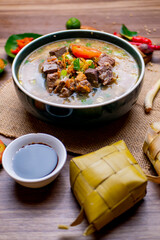 Coto Makassar is a traditional food of Makassar, Indonesia. This food is made from boiled offal (stomach contents) in a long time and seasoned with specially formulated spices with a cup of tea