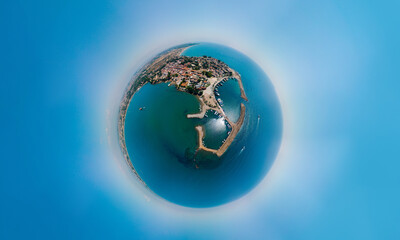 Aerial Little planet view of the bay, ships and boats. Touristic place, ancient buildings, the Colosseum and the Temple of Apollo. Turkey, Manavgad, Side. Copy space
