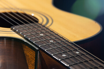 Close-up of a classical acoustic guitar in beautiful lighting.