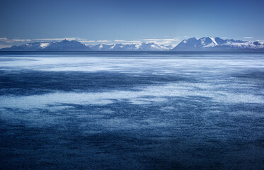 Winter in Patagonia: fjord with snow covered mountains in southern Chile