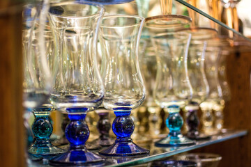 Glass ice cream glasses lined up on display stand