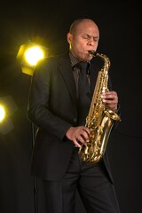 Jazz man playing a gold saxaphone