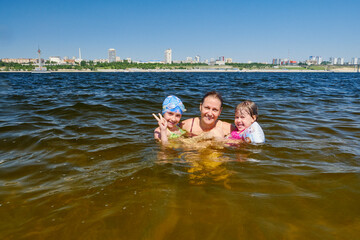 Children's summer vacation on the water with their parents.