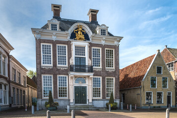 Fototapeta na wymiar The town hall of Harlingen at the Noorderhaven, Friesland Province, The Netherlands