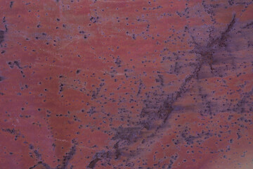 Painted in red old cracked metal rusted background. Metal texture. Erosion metal. Scratched and dirty texture on outdoor metal wall.