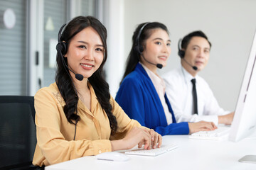 Fototapeta premium portrait woman operator wearing headphones for working at call center service