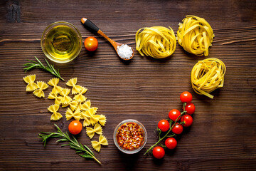 Frame of fettuccine with ingredients for cooking italian pasta