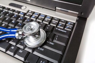 Medical steel stethoscope on Computer Keyboard