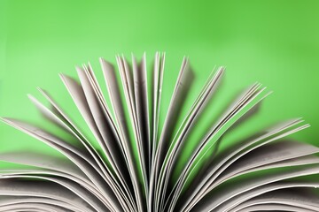 Open Book pages on green background