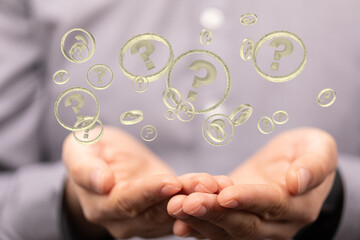 Businessman solving problem with digital question marks 3D rendering
