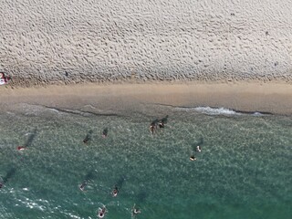 Aerial view of kanali beach crowded with tourists, famous tourist destination in preveza, epirus, greece