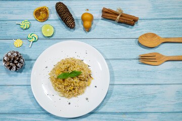 The brown soy sauce egg fried rice looks appetizing on the dining table.