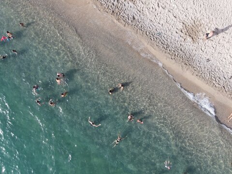Aerial view of kanali beach crowded with tourists, famous tourist destination in preveza, epirus, greece