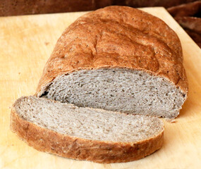 Rye bread on a wooden cutting board, wholemeal bread, brown bread