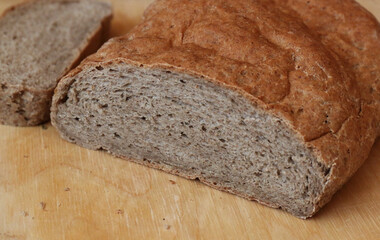Rye bread on a wooden cutting board, wholemeal bread, brown bread