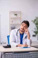 Young male doctor working in the clinic