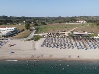 Aerial view of kanali beach crowded with tourists, famous tourist destination in preveza, epirus, greece
