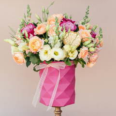 bouquet delicate flowers pink beige background