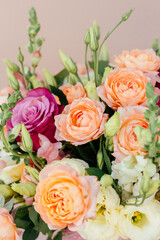 bouquet delicate flowers pink beige background close up