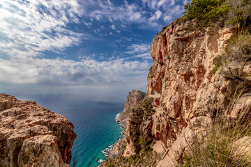 natural park serra gelada in benidorm. view of cliffs in a clouds sky, landscape located in the Valencian community, Alicante, Spain