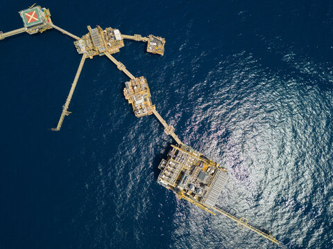 Central processing platform (cpp) in the middle of the ocean on sunny day - upstream industry.
