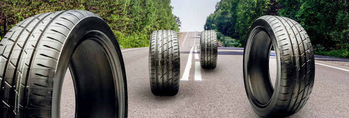 summer tires roll on the asphalt road. the season of changing tires