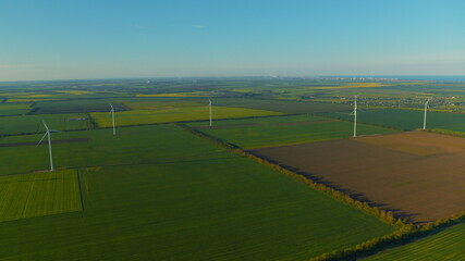 Aerial view wind turbines producing alternative energy for sustainable industry.