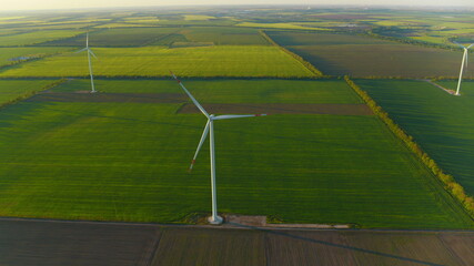 Aerial view of windmills farm generating power. Wind turbines producing energy.