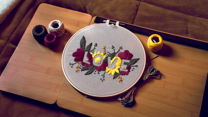 Word love embroidered on an embroidery hoop © Ossama Mohamed/Wirestock