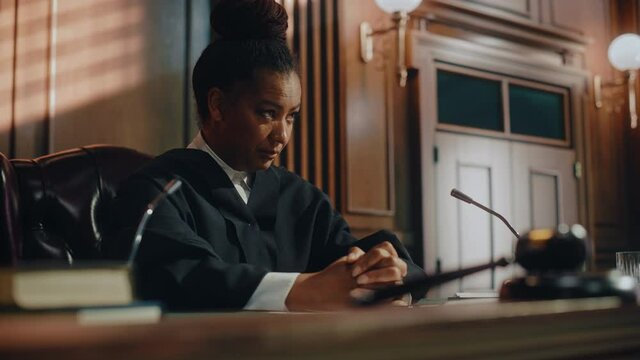Court of Law Trial: Honorable Female Judge Discussing Pleaded Case, Explaining Her Deliberations, Decision of Guilty or Innocent Verdict after Hearing Arguments. Dramatic Speech of Wise Justice