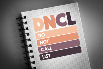 DNCL - Do Not Call List acronym on notepad, business concept background