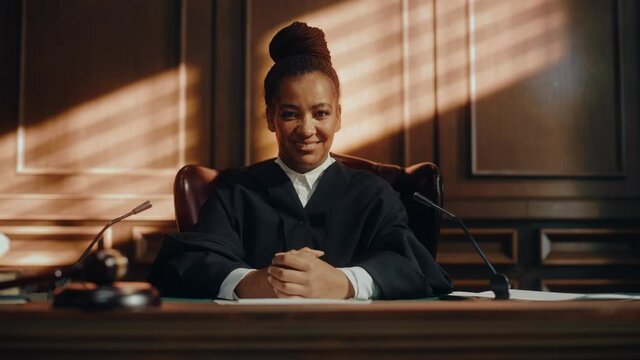 Cinematic Court of Law Trial: Portrait of Impartial Smiling Female Judge Looking at Camera. Wise, Incorruptible, Fair Justice Doing Her Job Professionally, Sentencing Criminals and Protecting Innocent